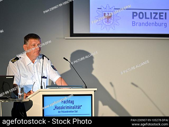 07 September 2023, Brandenburg, Cottbus: Sven Bogacz, Head of the Southern Police Directorate, opens the symposium on hate crime at the Cottbus exhibition...