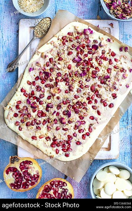 White chocolate bark with pomegranate and rose petals