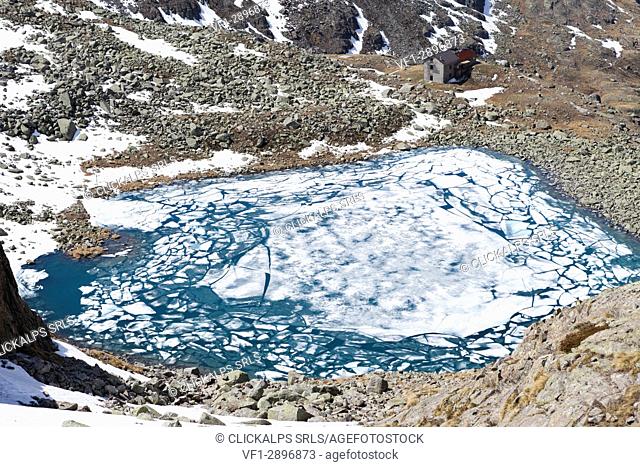 Ice and clear water at Lago Rotondo during thaw Val Malga Adamello Regional Park province of Brescia Lombardy Italy Europe