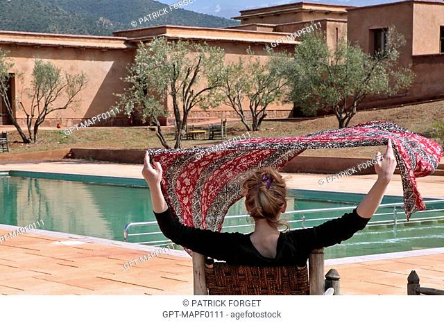 RELAXING BY THE POOL, ECO-LODGES IN THE TERRES D'AMANAR NATURE PARK, TAHANAOUTE, AL HAOUZ, MOROCCO