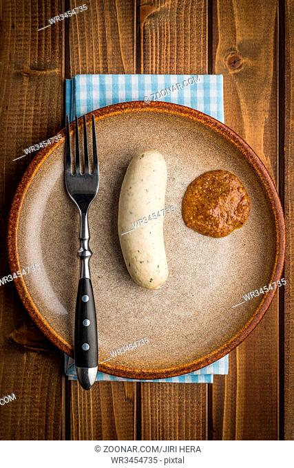 The bavarian weisswurst and mustard. Top view