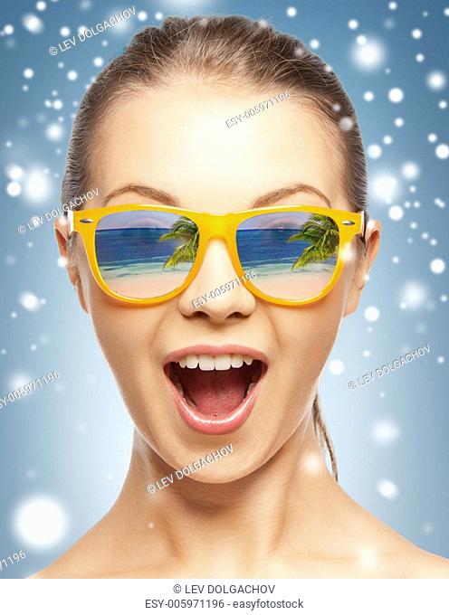 holidays, beauty and happiness - amazed girl in shades with beach reflection