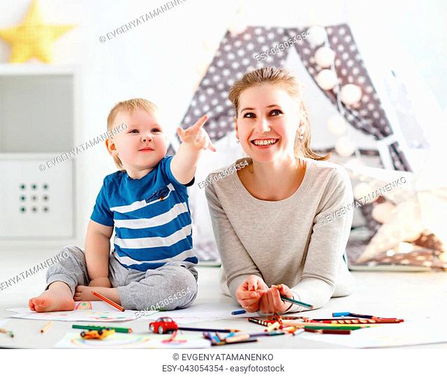 children's creativity. mother and baby son drawing together