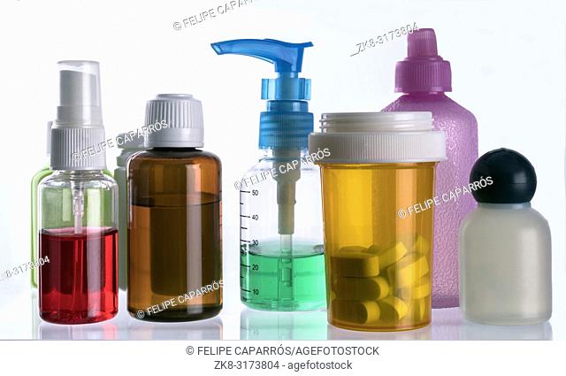 Different types of cosmetic containers and isolated medicines on a white background