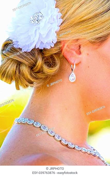 A beautiful bride wearing her wedding dress on her special day at a vineyard outdoors in Oregon during the summer