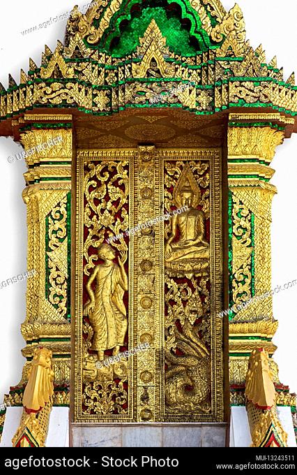 Door with gilded carvings illustrating mythological creatures and scenes from the life of the Buddha, Haw Pha Bang Temple, Luang Prabang, Laos