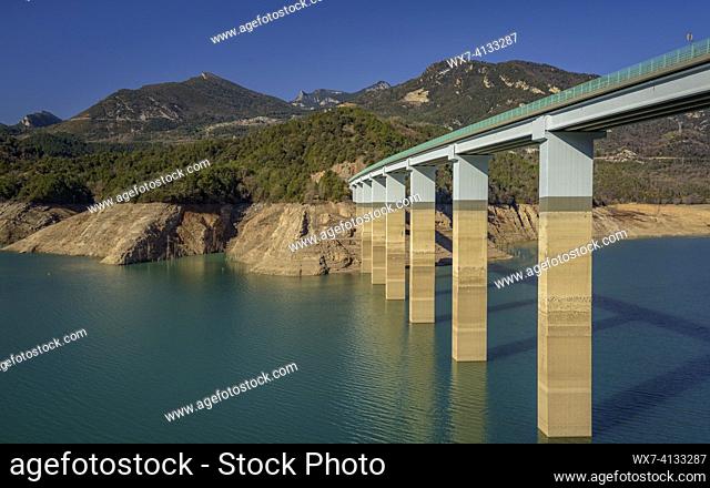 Bridge over La Baells reservoir with a very low water level (26%) during the 2023 drought (Berguedá , Barcelona, Catalonia, Spain)