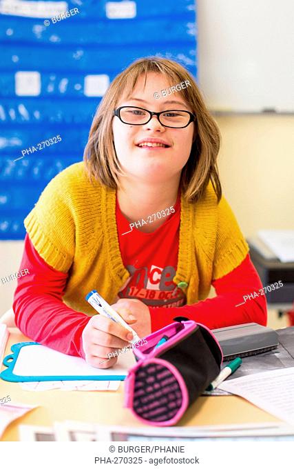 Teenage girl with Down syndrome 13 year old educated in ULIS (Localised Units for Inclusion School). Charente, France