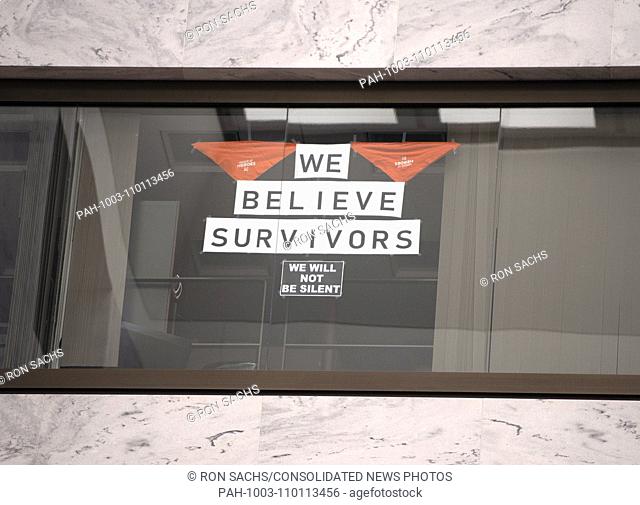Signs in the window of an unidentified United States Senator's office that overlooks the Atrium in the Hart Senate Office Building where many of the...