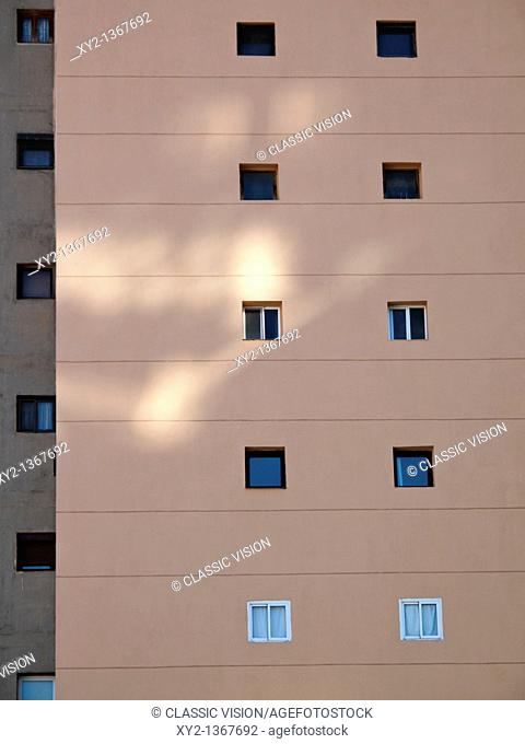 Windows in an apartment block wall
