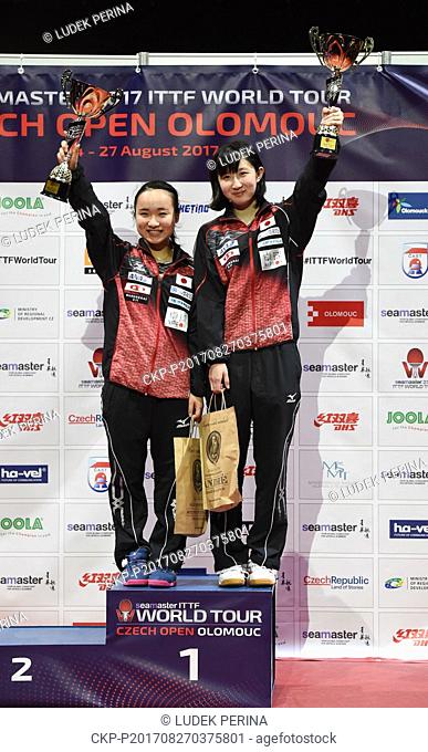 Mima Ito, left, and Hina Hayata of Japan pose with trophy after winning their final match of the women's doubles at the Table Tennis World Tour Czech Open in...