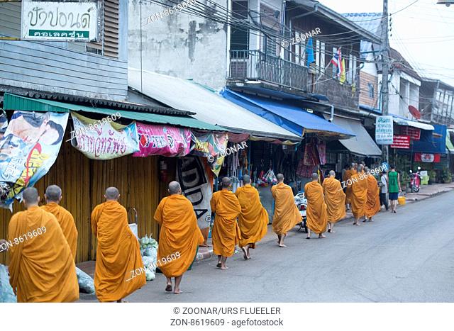 monks at the market in the Village of Thong Pha Phum north of the City of Kanchanaburi in Central Thailand in Southeastasia