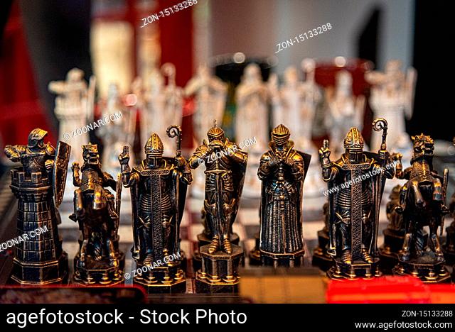 LIVERPOOL, ENGLAND, DECEMBER 27, 2018: The Wizard Chess model. Figurines of the Harry Potter chess game. Focused on blacks while whites are in bokeh