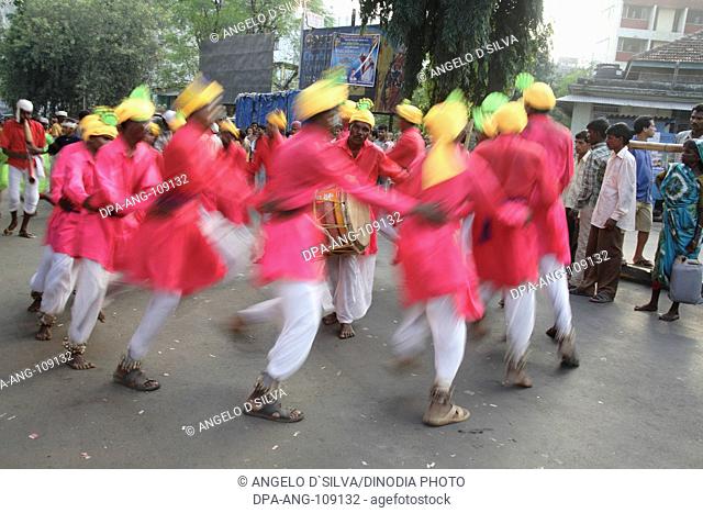 Adivasi from Mokhada performing tribal dance during the religious procession at Court Naka ; Thane ; Maharashtra ; India ; NO MR