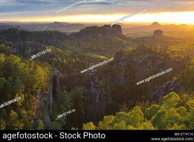View from Carola Rock over Elbe Sandstone Mountains with Schrammsteine, Falkenstein, Königstein and Lilienstein, sunset in the National Park Saxon Switzerland