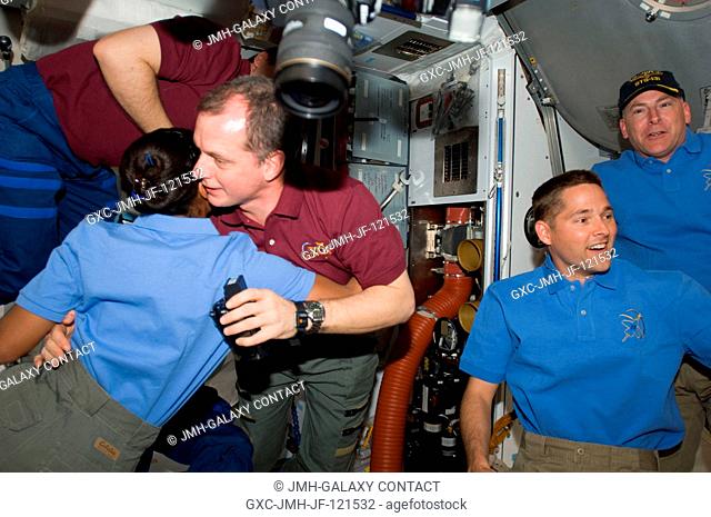 NASA astronaut T.J. Creamer (near frame center), Expedition 23 flight engineer, is greeted by members of the STS-131 Discovery crew