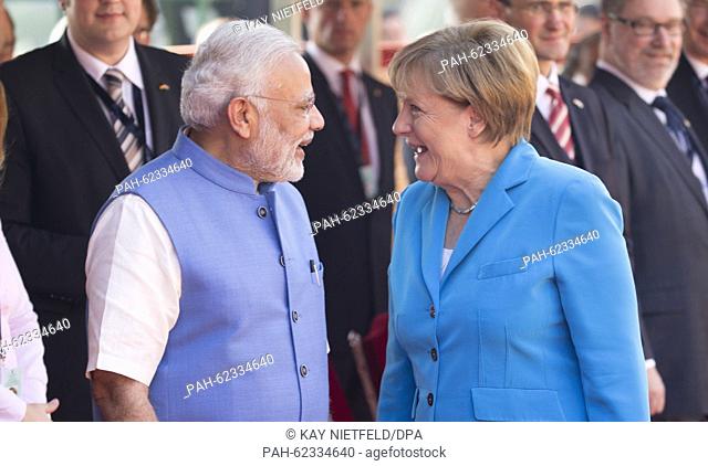 German Chancellor Angela Merkel (L) is greeted by Indian Prime Minister Narendra Modi (R) on her arrival in New Dehli, India, 05 October 2015