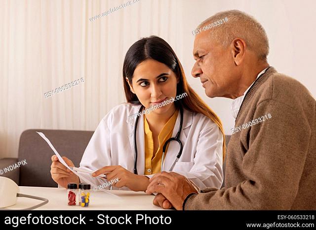 Lady doctor talking with the sick senior man