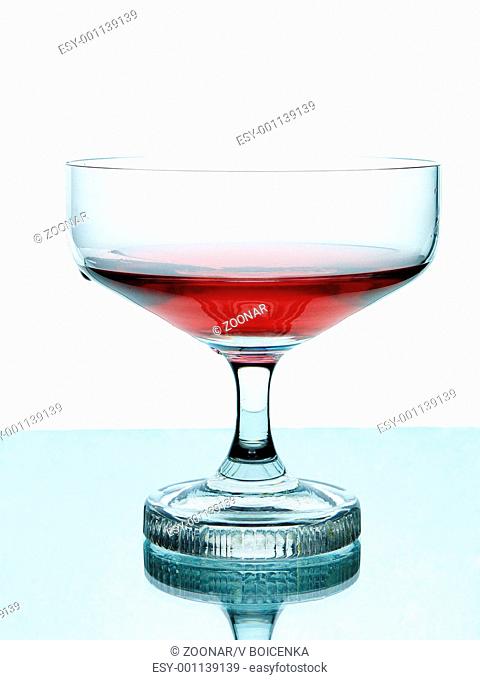 Red wine in glass. Isolated on white background