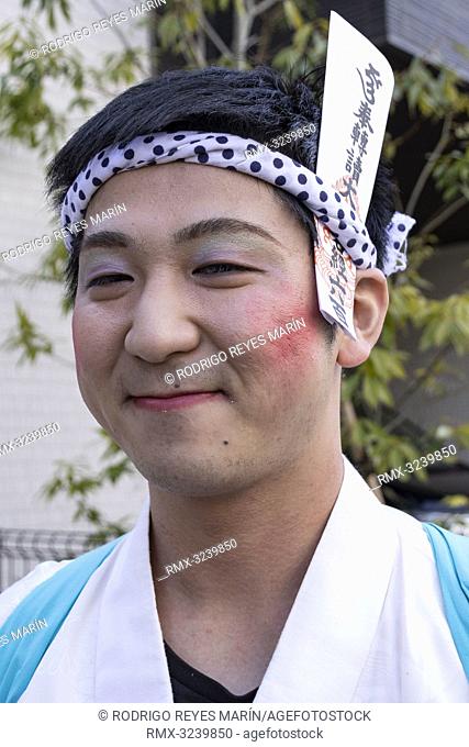 February 24, 2019, Tokyo, Japan - A man dressed in women's kimonos and wearing makeup, poses for a photograph during the Ikazuchi no Daihannya festival