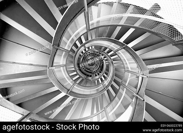 Innsbruck, Austria - June 8, 2018: View of the spiral staircase inside the historic Town Tower in black and white