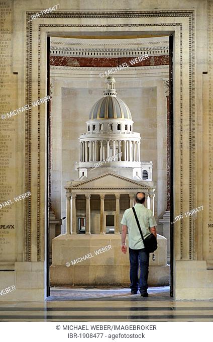 Tourist standing in front of a model, Panthéon, a mausoleum for French National heroes, Montagne Sainte-Geneviève, Hill of St