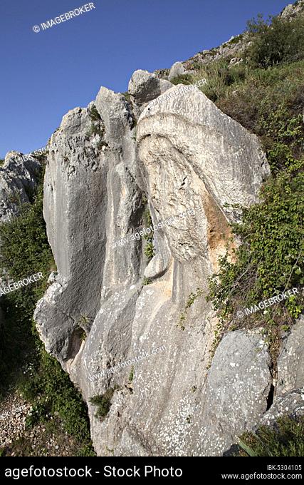 The Charonion of Hell (Water Sprite of Hell) is located north of the cave church of St. Pierre (about 200 m) and is an ancient carved stone bust in the hillside...