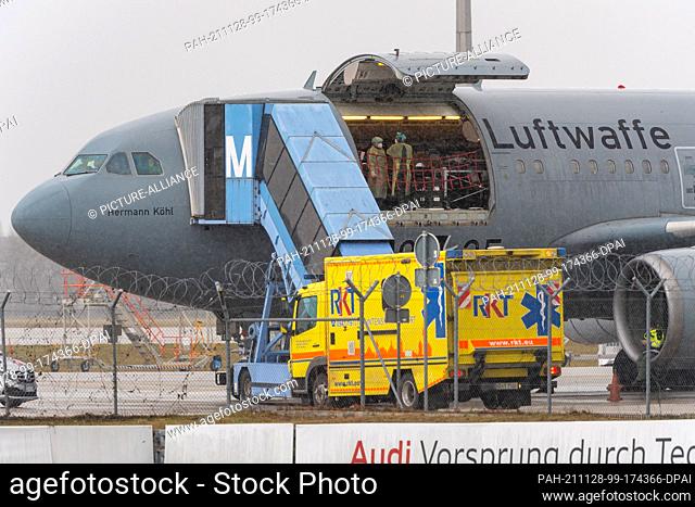 28 November 2021, Bavaria, Munich: A Corona relief flight of the German Air Force is parked in the cargo area of Munich Airport