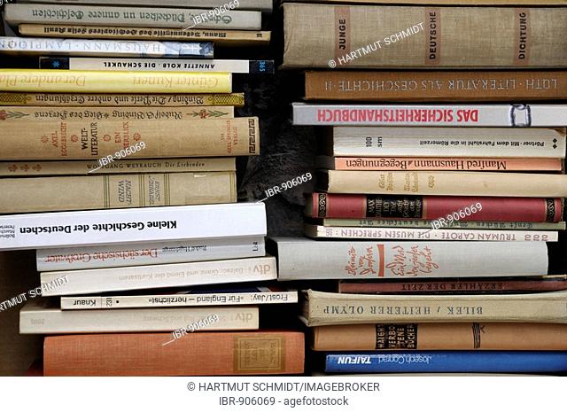 Piles of old or antique books