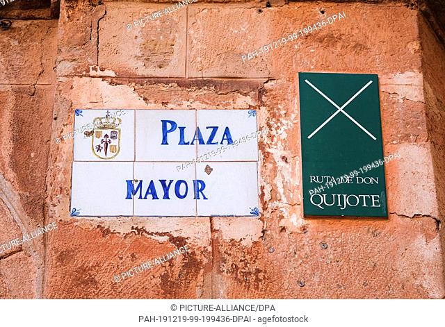 27 September 2019, Spain, Villanueva De Los Infantes: A sign on the Plaza Mayor square points to the Ruta de Don Quijote