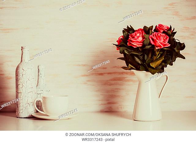 Luxury bouquet of roses lying over wooden wall. Copy space