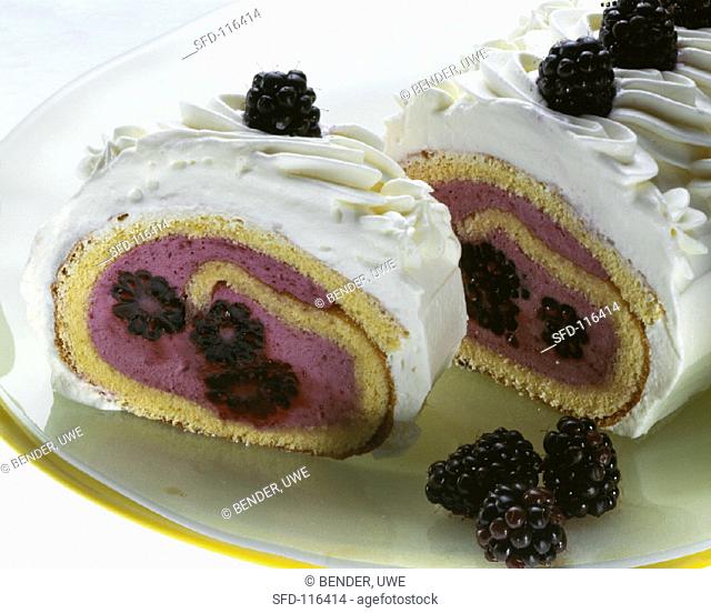 Sponge roulade with blackberry cream filling
