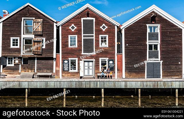 Hudiksvall, Halsingland, Gavleborg County -Sweden - 08 01 2019 Reflecting fishing warehouses in the city center