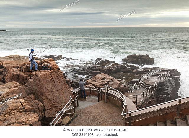 USA, Maine, Mt. Desert Island, Acadia National Park, coastal view by Thunder Hole with visitor, NR