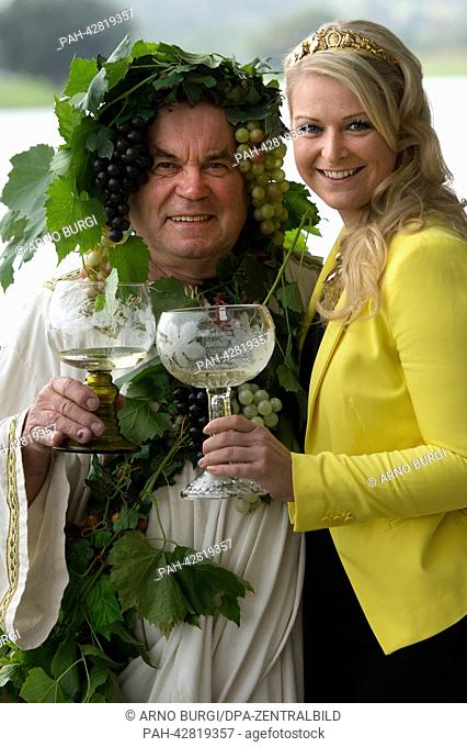 Herbert Graedtke dressed as wine god 'Bacchus', Saxonian wine queen Katja Riedel pose during a photo shooting for the Radebeul wine festival 2013 (Radebeuler...