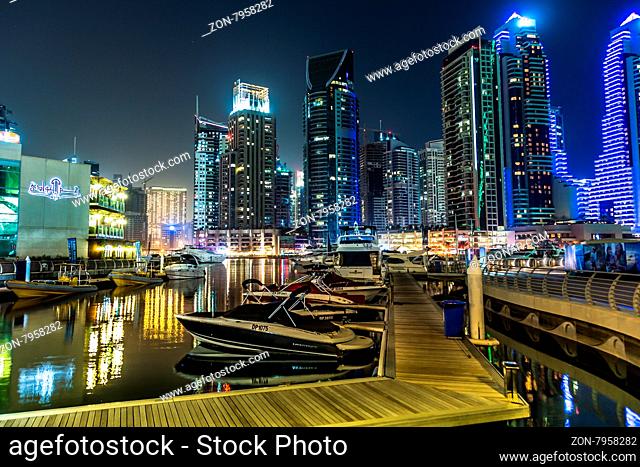DUBAI, UAE - NOVEMBER 13: Dubai downtown night scene with city lights, luxury new high tech town in middle East. Dubai Marina cityscape, on November 13