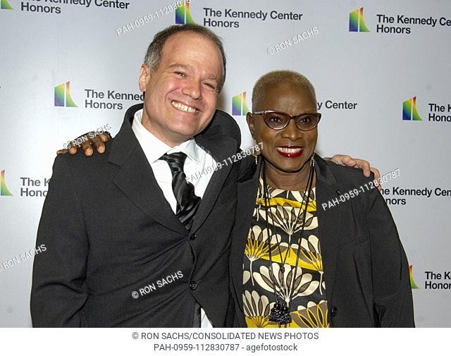 Singer Angelique Kidjo, right, and Kevin Morris arrive for the formal Artist's Dinner honoring the recipients of the 41st Annual Kennedy Center Honors hosted by...
