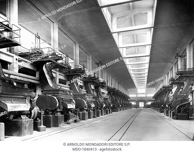 The disintegrators in a room of the SNIA Viscosa factory ready to rip the alkali cellulose up. Turin, 1920s