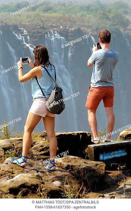 Tourists visiting the Zimbabwean side of the the Victoria Falls, pictured on 30.07.2015. The Victoria Falls are the broad waterfalls of the Zambezi at the...