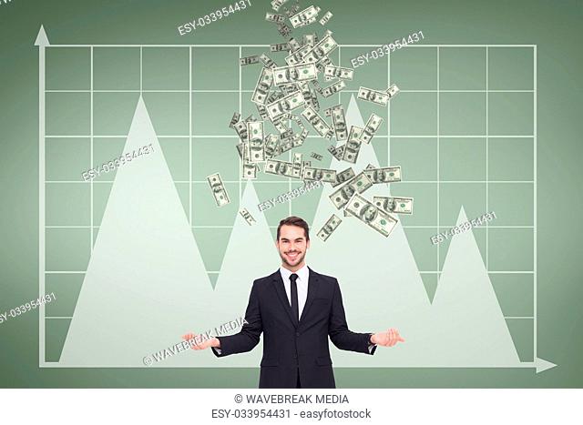 Happy business man with money rain against green background with graphics