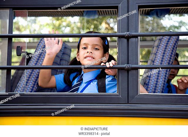 School girl sitting in a school bus