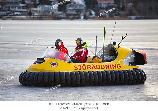 Open hovercraft of the Swedish Rescue Society on the ice of Lake Malaren.  A voluntary non profit organisation founded in 1907
