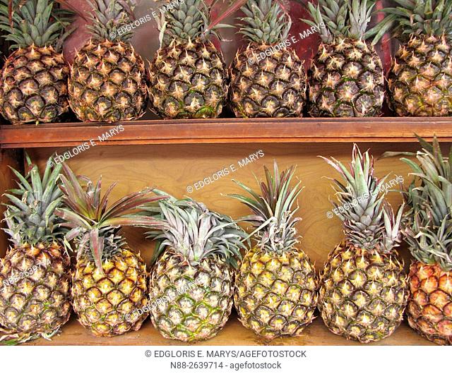 Pineapples display in a tropical fruit market