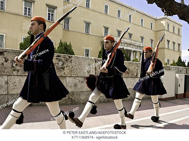 Evzones marching back to barracks from Syndagma square in the center of Athens, Greece The Evzones are an elite core of Greek soldiers used to guard the tomb of...
