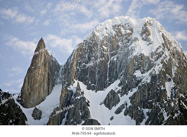 On the left the granite spire known as Lady Finger peak, or Bubulimating, summit 6, 000m, high above Karimabad in the Karakoram mountains of the Northern Areas