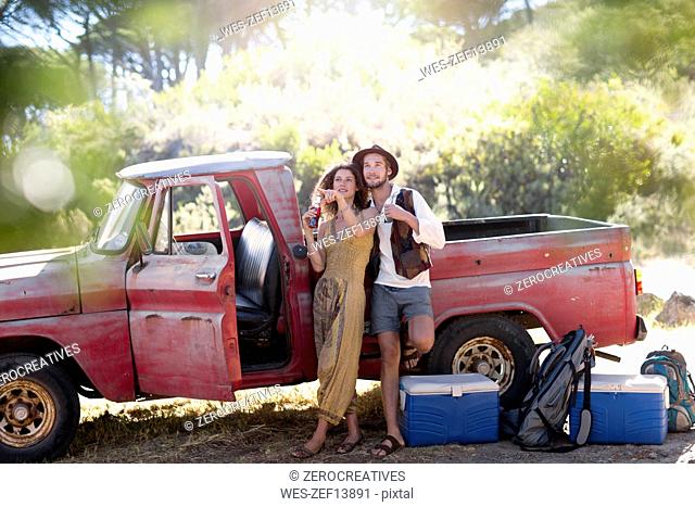 Young couple at old pick up truck