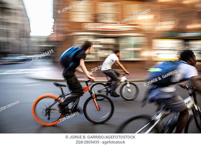 American boys doing stunts on the bicycle in the streets of Boston