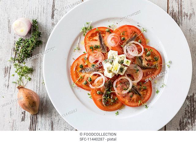 Tomato salad with anchovies and feta cheese