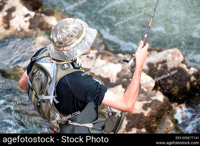 Aerial view of sport Fisher fishing in the river