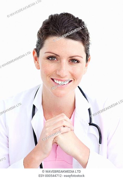 Portrait of a doctor holding a stethoscope against a white background